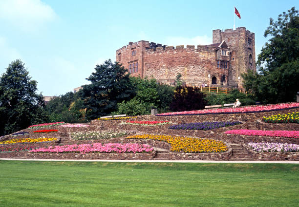 Tamworth Castle, UK. View of the castle grounds with castle to rear during the summer, Tamworth, Staffordshire, England, UK, Western Europe. norman uk tree sunlight stock pictures, royalty-free photos & images