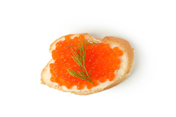 istock Sandwich with red caviar and dill isolated on white background 1301550290