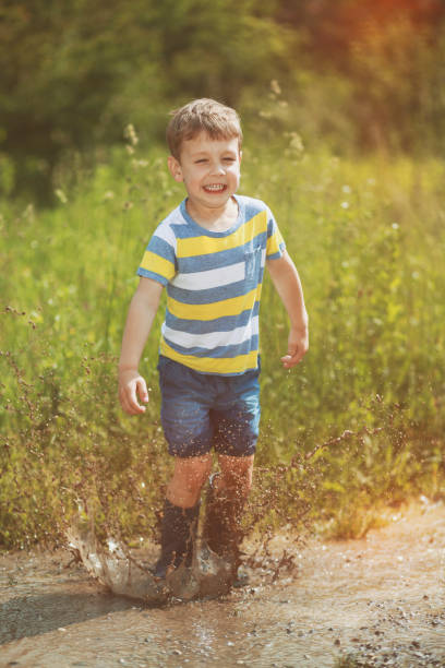 istock Boy jumping in paddles 1301550725
