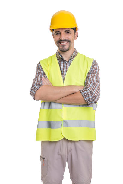 istock Cheerful male constructor standing with crossed arms 1301552180