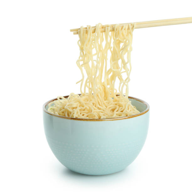 istock Bowl and chopsticks with noodles isolated on white background 1301553256