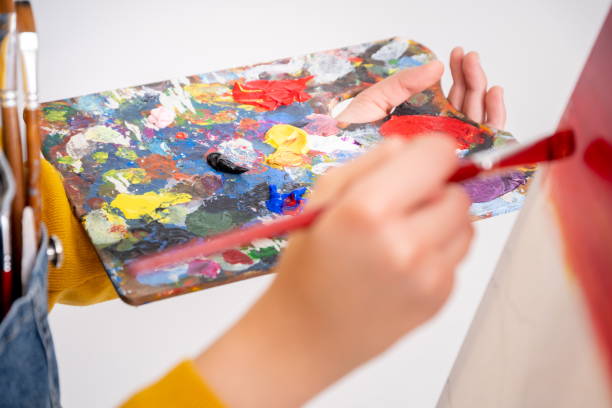 istock artist painting in workshop, white background 1301553523
