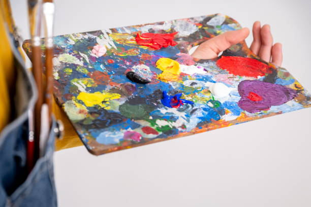 istock Painter's palette stained with many colors 1301553583