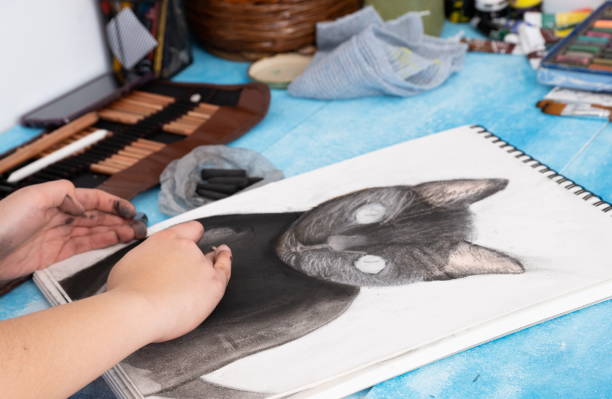 istock Painting cat in charcoal on a blue background 1301553634