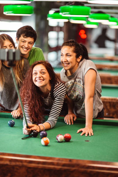 istock friends take a selfie together at billiards 1301554730