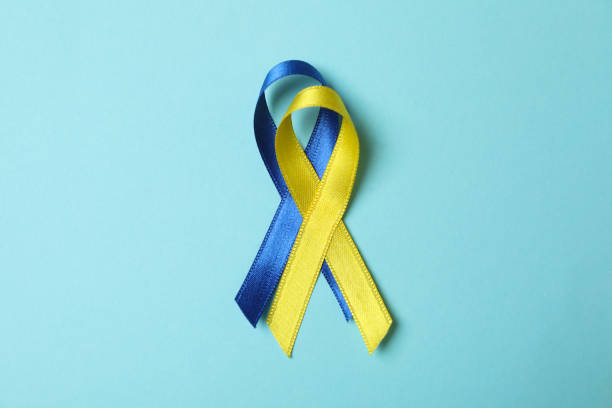 istock Down's syndrome awareness ribbons on blue background 1301554961