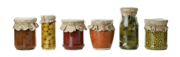 istock Jars with different canned food isolated on white background 1301556206