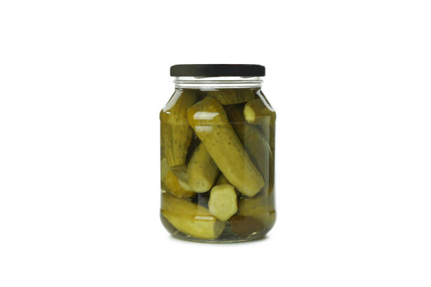 istock Jar with pickled cucumbers isolated on white background 1301556711
