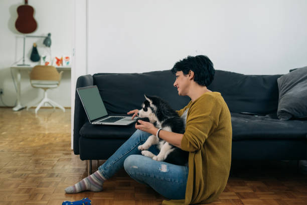 istock woman at home, enjoying time with her dog 1301557551