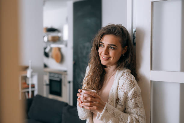 istock woman relaxing at home 1301557914