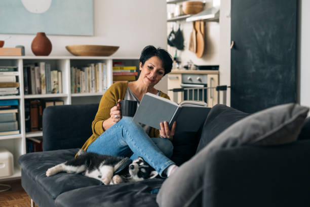 istock woman at home, enjoying time with her dog 1301557916