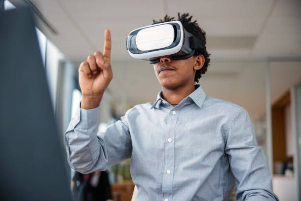 istock Business professional interacting with a virtual headset in his office 1301559040