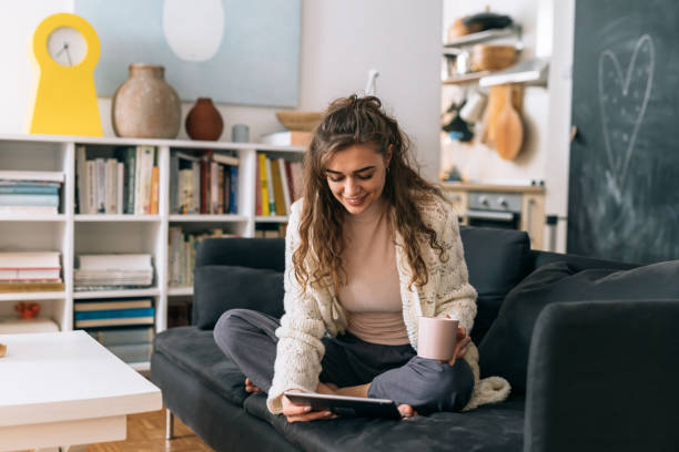 istock woman relaxing at home 1301559050