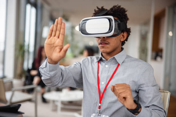 istock Business professional interacting with a virtual headset in his office 1301559289