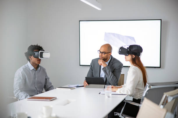 istock Businessman presenting 3d model to his colleagues thought virtual reality headsets 1301560054