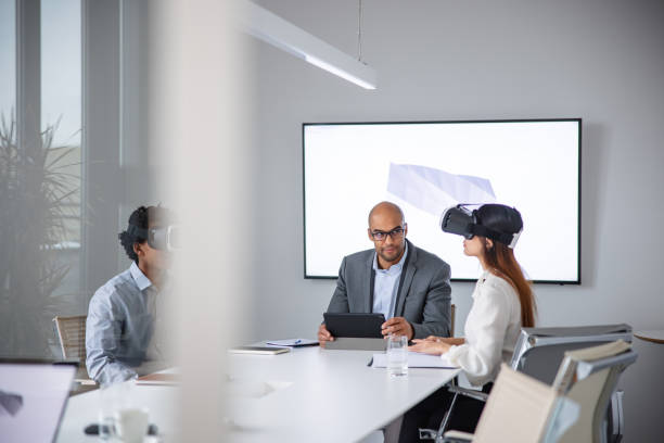 istock Businessman presenting 3d model to his colleagues thought virtual reality headsets 1301560078