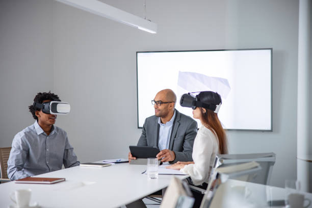 istock Businessman presenting 3d model to his colleagues thought virtual reality headsets 1301560090