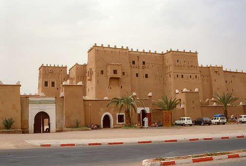 Ouarzazate, Morocco - Aug 12, 1989: A traditional kasbah has been converted into a luxury hotel in the Draa Valley near Ouarzazate.