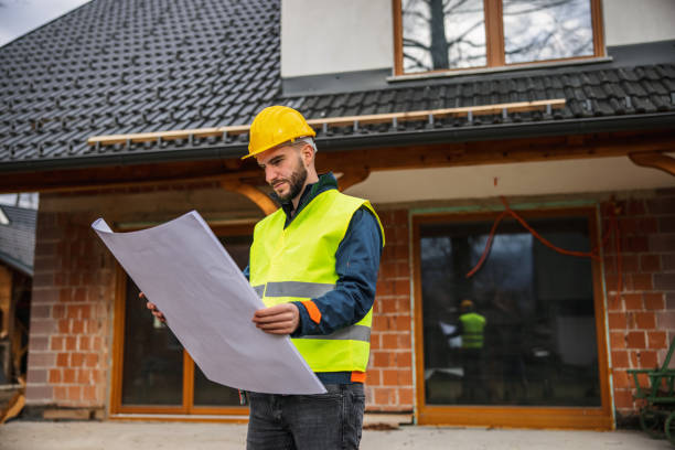 istock Caucasian Construction Worker Holding A Blueprint And Looking Around 1301560533
