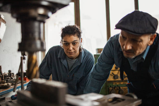 istock Coworkers at mechanic workshop 1301560642
