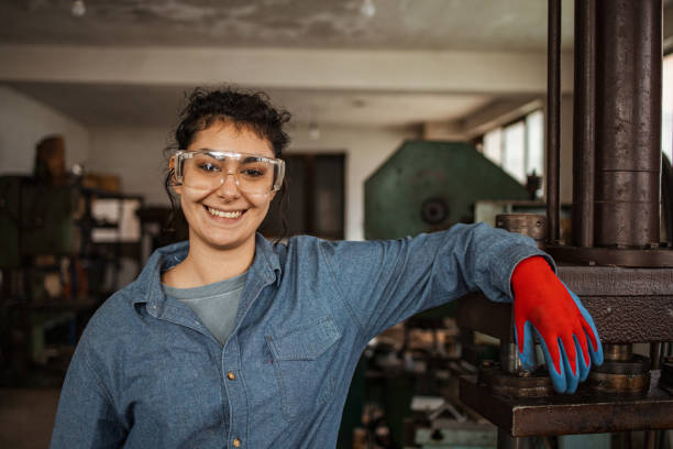 istock Happy female mechanic at her work place 1301560791
