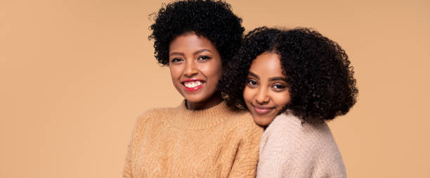 istock Two young beautiful afro women posing together 1301561553