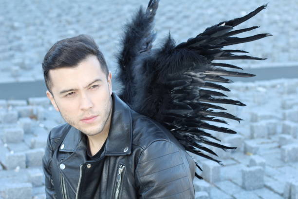 Urban angel with black wings.