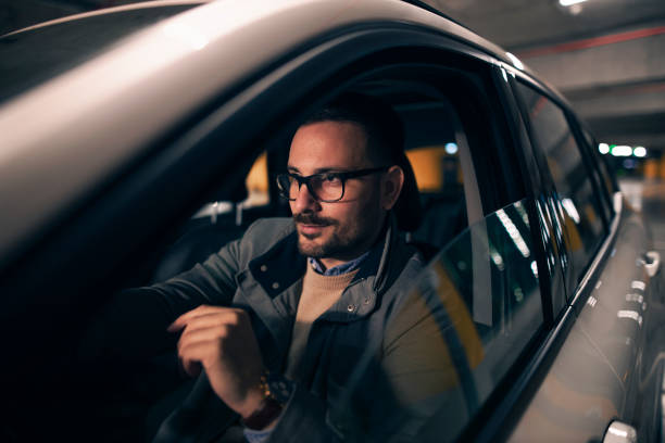 istock Businessman in his modern car 1301564318