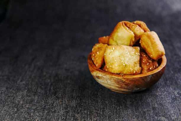 istock Fried cake served in a wooden bowl 1301564417