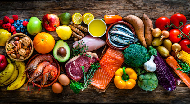 paleo-diät gesunde ernährung hintergrund - paleo diät stock-fotos und bilder