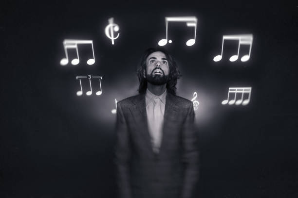 man listens in ecstasy to music that he visualises in the air