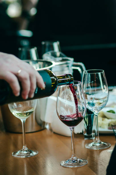 istock Wine tasting experience  with  glasses of wine on a table. Black and white background 1301568426