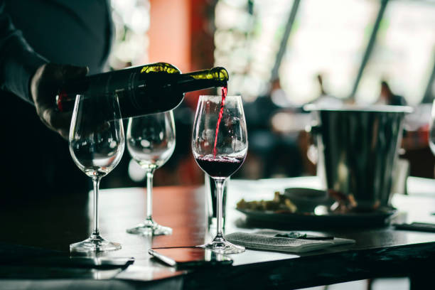 istock Wine tasting experience  with  glasses of wine on a table. Black and white background 1301568623