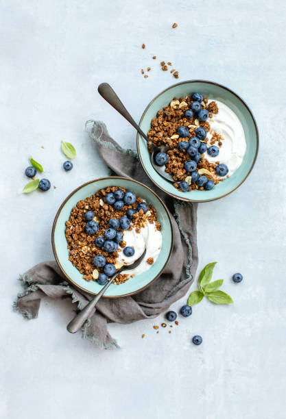 istock Homemade granola with ripe blueberries, top down view 1301569436