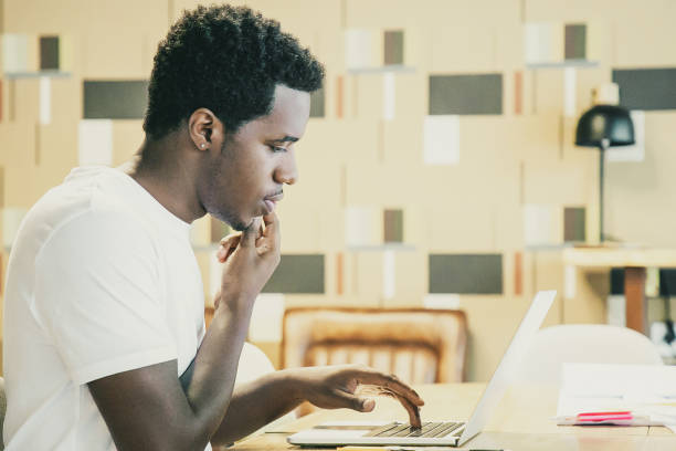 istock Focused designer discussing project with customer on phone 1301569437