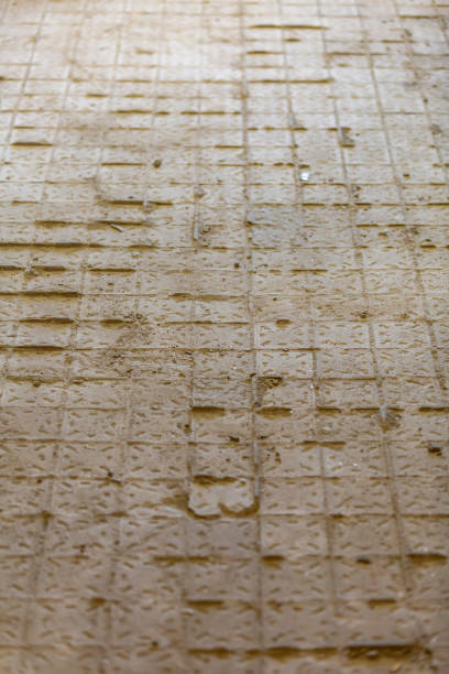 istock Unfinished renovation of a tile floor in a building 1301570835