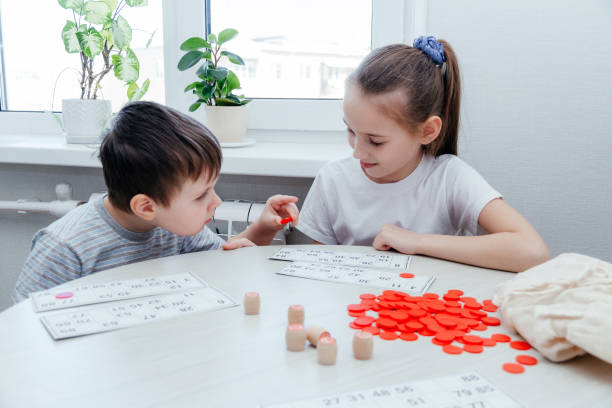 istock Children play Russian lotto on the table. 1301570919