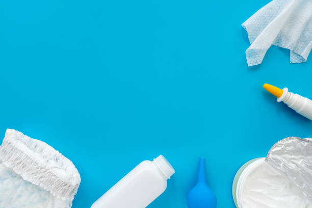 istock White powder, diaper, cream, napkin on a blue background, flatley, top view, copy space, mock up. Baby hygiene, background for newborn boys 1301573383