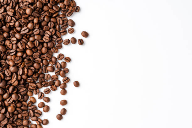 istock Roasted coffee beans isolated on white background. Close up 1301577769