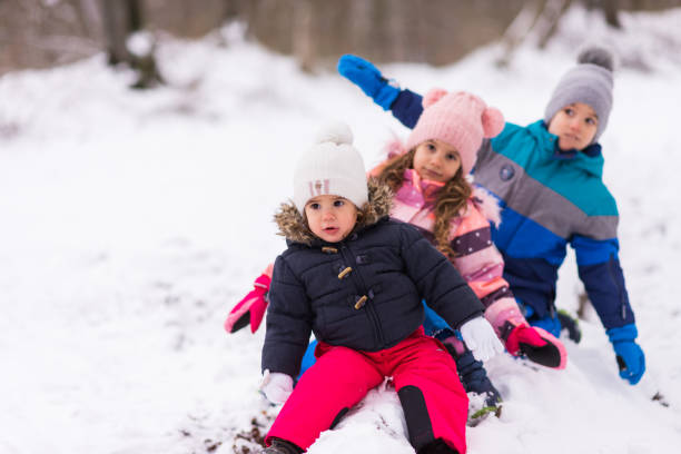 istock Children having fun on the snow 1301579133