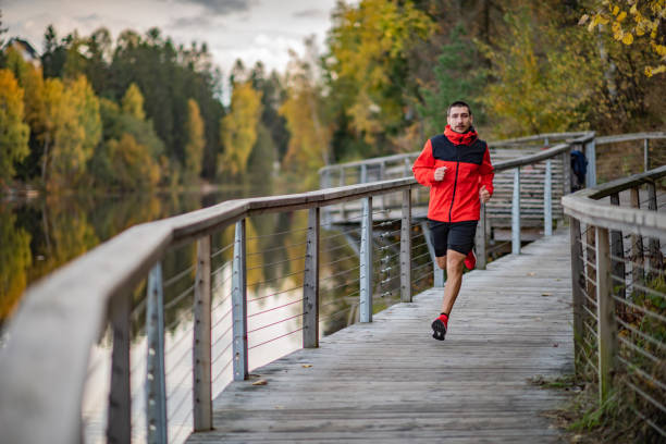 istock Young man jogging in nature. 1301582218