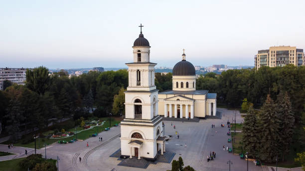 Aerial drone view of Chisinau, Moldova Aerial drone view of Chisinau downtown. Panorama view of central park with green trees and multiple walking people, catheral, buildings on the background. Moldova chisinau photos stock pictures, royalty-free photos & images