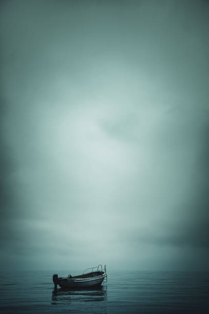 istock Lonely boat in calm water in the harbor, horror 1301585077