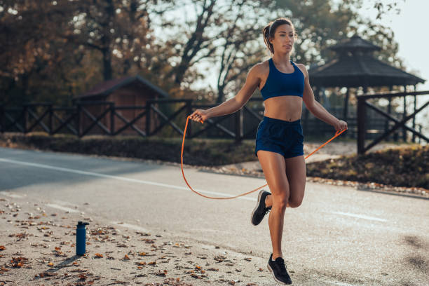 istock Athlete woman using skipping rope. 1301585274