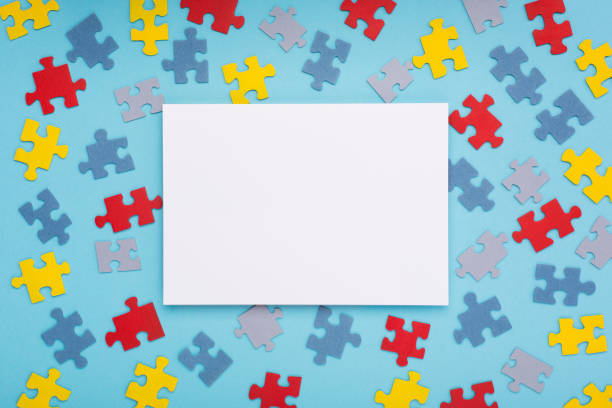 istock Creative design for April 2, Autism World Awareness day. Jigsaw colorful puzzle element, top view, flat lay. 1301586728