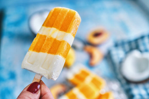 istock Mango Peach Yogurt Ice Cream on Stick 1301586795