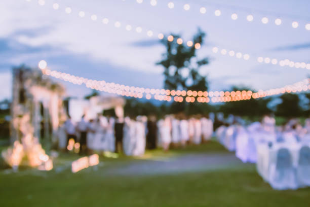 istock Abstract blur crowd congratulates the newlyweds. Organizing a celebration outside 1301587859
