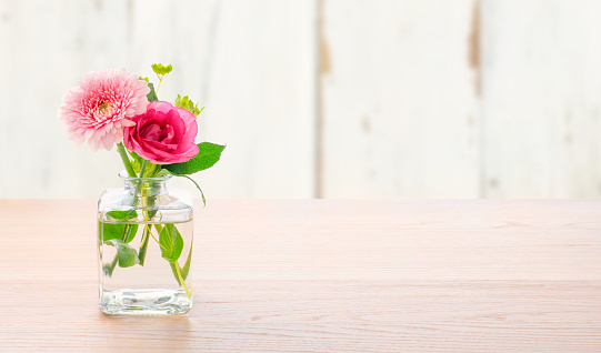 Flowers in a glass vase with copy space