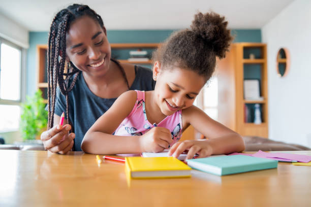 istock A father helping her daughter with homeschool. 1301590483