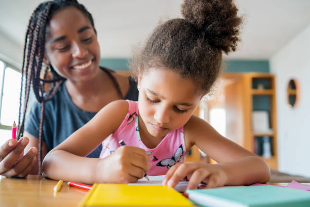 istock A father helping her daughter with homeschool. 1301590499
